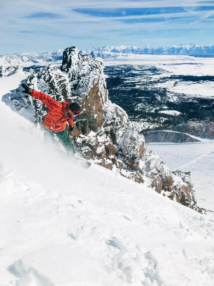 Young man snowboarding